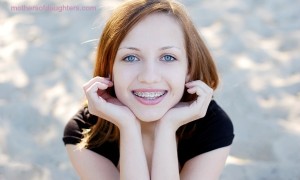 Pretty girl wearing braces smiling cheerfully