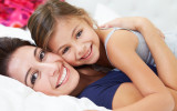 bigstock-Mother-And-Daughter-Lying-In-B-46827580